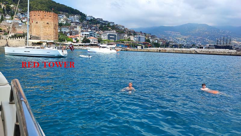 swimming near red tower